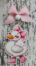Goose in pink rain boots and bow car freshie